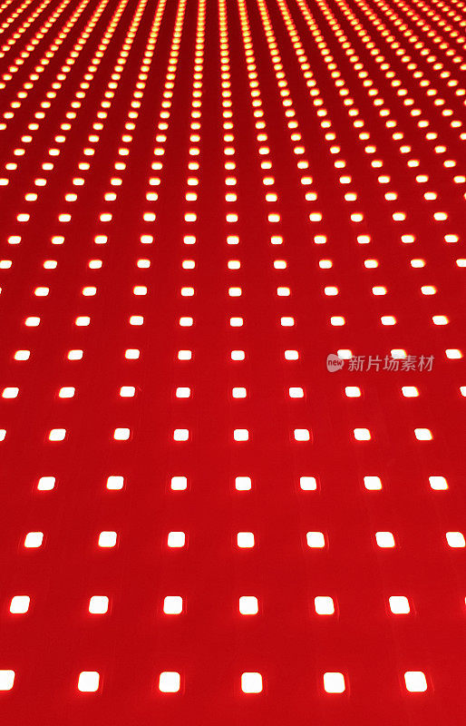 RGB LED screen panel texture. Close-up of a pixel LED screen with bokeh for wallpaper. Bright red abstract background perfect for any design